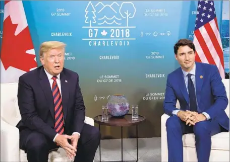  ?? Saul Loeb AFP/Getty Images ?? CANADIAN Prime Minister Justin Trudeau, right, has faced pressure to stand up to President Trump, who is very unpopular in Canada.