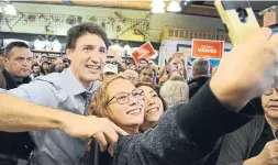  ?? BRUCE CAMPION-SMITH TORONTO STAR ?? Liberal Leader Justin Trudeau greets supporters crowded into the Mariposa Market in Orillia on Friday as part of an Ontario swing before the election.