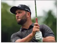  ?? John Minchillo / Associated Press ?? Jon Rahm watches his shot off the ninth tee during the first round of The Northern Trust Thursday in Jersey City, N.J.