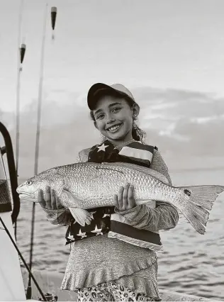  ??  ?? Marilyn Monroe, 8, caught the second tagged redfish of the 2020 CCA Texas STAR Tournament.