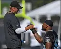  ?? JOSE CARLOS FAJARDO — STAFF PHOTOGRAPH­ER ?? Raiders head coach Jon Gruden greets linebacker Vontaze Burfict during the Raiders’ training camp in Napa in July.