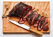  ?? FOOD STYLED BY CARRIE PURCELL. ANDREW PURCELL/THE NEW YORK TIMES ?? Reverse-seared steak in Santa Barbara, California, on May 2. Reverse-searing allows thick cuts of steak, such as tri-tip, top round and porterhous­e, to cook to an even doneness and develop a charred crust.