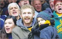  ?? FM4569915 left, FM4569918 ?? Seven-year-old Stones fan George Kybert is all ready and, right, supporters back their team