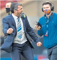  ??  ?? St Johnstone manager Callum Davidson roars in delight as he celebrates winning the Betfred Cup after the Perth side’s 1-0 victory against Livingston at Hampden Park.