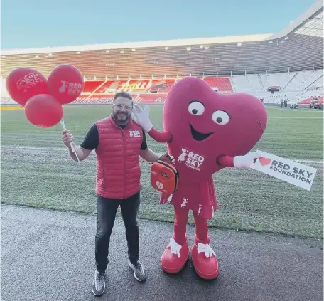  ?? ?? Red Sky Foundation founder Sergio Petrucci with new mascot Miss Beats at the Stadium of Light.