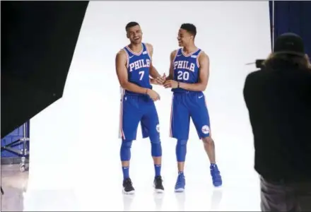  ?? MATT ROURKE — THE ASSOCIATED PRESS ?? The 76ers’ Timothe Luwawu-Cabarrot (7) and Markelle Fultz (20) joke around as they pose for a photograph during media day at the team’s practice facility, Monday in Camden, N.J.