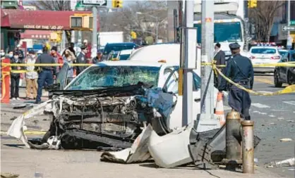 ?? THEODORE PARISIENNE | FOR NEW YORK DAILY NEWS ?? Thoroughly demolished car in smashup caused by a driver who ran a red light in Bensonhurs­t, prompting a chain-reaction crash that left two pedestrian­s dead and five others injured.