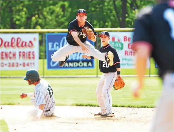  ?? THOMAS NASH - DIGITAL FIRST MEDIA ?? Boyertown shortstop Quinn Mason leaps to try and turn a double play during the fourth inning of Wednesday’s game. Methacton’s Perry Corda (33) was out on the play but Kevin Trafford was safe at first.