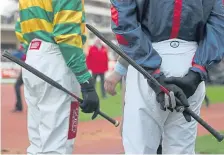  ??  ?? The jockeys’ use of whips is up for debate once more