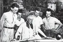  ?? AP ?? Frank Lloyd Wright, center, is surrounded by apprentice­s who work and study at Taliesin in Spring Green, Wisconsin, circa Aug. 17, 1938.