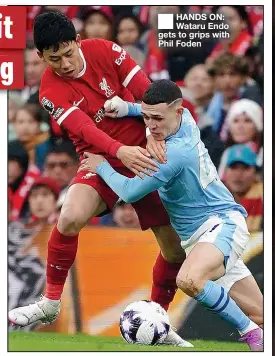  ?? ?? ■
HANDS ON: Wataru Endo gets to grips with Phil Foden