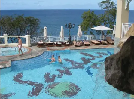  ?? PHOTO BY JOHN NOWLAN ?? Several tempting fresh water pools are spread along the Sandals La Toc Resort.