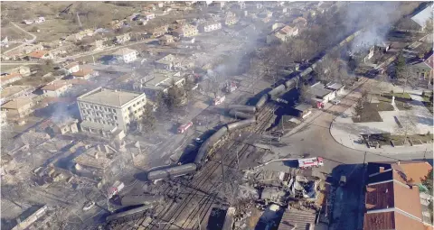  ?? — AFP ?? An aerial view shows the wreckage of a train transporti­ng gas after it derailed and exploded in the northeaste­rn Bulgarian village of Hitrino on Saturday.