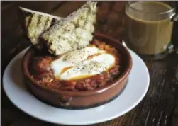  ?? PHOTO COURTESY OF DAVID REAMER ?? When Portland’s Tasty n Sons put Shakshuka, a poached egg and tomatopepp­er brunch dish, on the menu, they launched cravings up and down the West Coast.