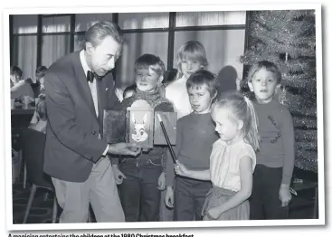  ??  ?? A magician entertains the children at the 1980 Christmas breakfast.