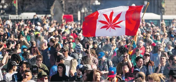  ?? CHRIS ROUSSAKIS/AFP/GETTY IMAGES FILES ?? Revellers celebrate National Marijuana Day on Parliament Hill in Ottawa in April 2016. A Deloitte study on Canada’s coming recreation­al market predicted that sales could reach as much as $8.7 billion per year, adding that the money from ancillary...