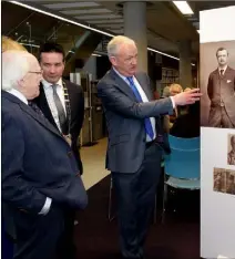  ??  ?? Jarlath Glynn showing President Higgins the Redmond exhibition at Wexford Library on Mallin Street.