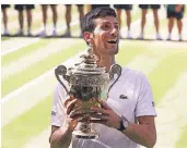  ?? FOTO: AP ?? Einer der Superstars der Branche: Der Serbe Novak Djokovic mit dem Wimbledon-Pokal.