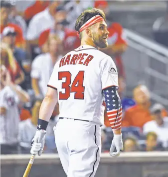  ?? Washington Post / Getty Images 2018 ?? The Phillies, who all but promised to sign either Bryce Harper (above) or Manny Machado with the “stupid money” the owner pledged to spend, might feel pressure to get Harper at any cost.