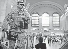  ?? MARY ALTAFFER, AP ?? Members of the U. S. armed forces stand guard in Grand Central Terminal Sunday in New York.