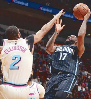  ?? AFP ?? Jonathon Simmons of the Orlando Magic challenges Wayne Ellington of the Miami Heat as he drives to the basket during the NBA game in Miami, Florida.