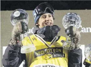  ?? JACQUES BOISSINOT/THE CANADIAN PRESS FILES ?? Mark McMorris, seen holding his Crystal Globes in February, says he thought he would be unable to snowboard again after a disastrous crash in March.