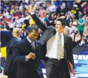  ?? OHIO BOBCATS ATHLETICS COMMUNICAT­IONS PHOTO ?? Aaron Fuss, with arm raised, has joined the UTC men’s basketball staff.