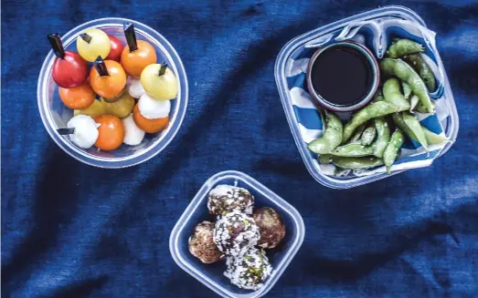  ?? Scott Price ?? Repurpose leftovers such as pasta, left; prepare a platter with pitta bread, veggies and hummus, top; or make fresh summer rolls with rice paper, veggies, meat and herbs, bottom, for your little one’s lunch box. Snacks can include chocolate date balls,...
