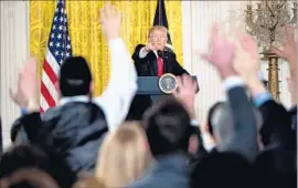  ?? Andrew Harnik Associated Press ?? PRESIDENT TRUMP presides over a news conference Thursday. The result quickly has pundits and the public comparing it to TV shows or the movies.