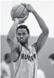  ?? Brett Coomer / Houston Chronicle ?? Roger Moute a Bidias takes his best shot in the Rockets’ rookie summer league.