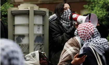  ?? Anna Moneymaker/Getty Images ?? Pro-Palestine activists on the outskirts of University Yard at George Washington University in Washington DC on Friday. Photograph: