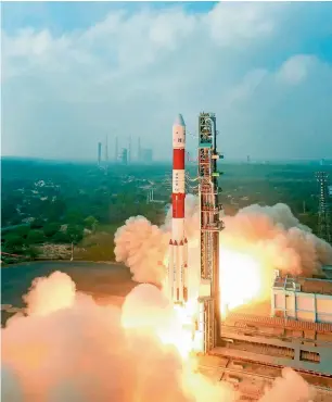  ?? PTI ?? PSLV-C40 carrying Cartosat series along with 30 other satellites lifts off from first launch pad at Sriharikot­a, on Friday. The lift-off marks 100th launch by Isro. —