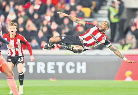  ?? — AFP file photo ?? Brentford’s English striker (right) Ivan Toney prepares for a volley that never comes to him during the English Premier League match between Brentford and Nottingham Forest at Gtech Community Stadium in London.