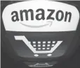  ?? LIONEL BONAVENTUR­E, AFP/ GETTY IMAGES ?? Amazon said it is committed to making food accessible through online grocery shopping by offering all customers the lowest prices possible.