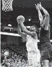  ?? Andy Lyons / Getty Images ?? Zion Williamson had 27 points and 12 rebounds to power No. 2 Duke to a come-from-behind win over No. 16 Louisville.