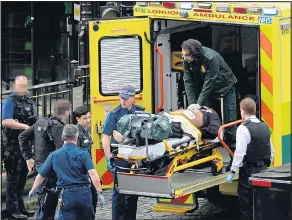  ??  ?? The attacker is put into an ambulance after being shot by police yesterday