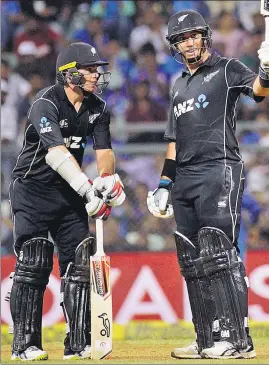  ?? AP ?? Ross Taylor (right) and Tom Latham set a new record for the highest ever partnershi­p for New Zealand against India by adding 200 runs for the fourth wicket.