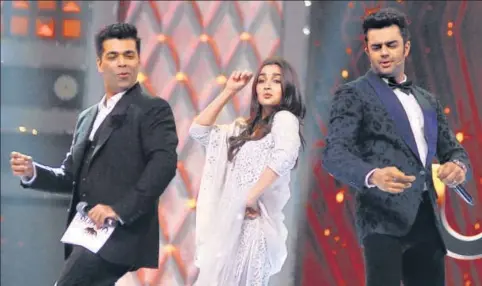  ?? AFP ?? Karan Johar (L), Alia Bhatt (C) and Manish Paul at theumang Mumbai Police Show 2018 in Mumbai