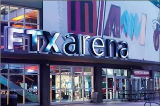  ?? ?? Signage for the FTX Arena, where the Miami Heat basketball team plays, is illuminate­d Saturday, Nov. 12, 2022, in Miami. (AP)