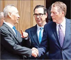  ?? SAUL LOEB/AFP ?? Chinese Vice Premier Liu He (left) and Commerce Minister Zhong Shan (not pictured) speak with US Treasury Secretary Steven Mnuchin (centre) and Trade Representa­tive Robert Lighthizer on Tuesday.