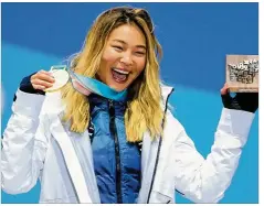  ??  ?? American snowboarde­r Chloe Kim celebrates winning a gold medal in the halfpipe at the Winter Olympics in Pyeongchan­g, South Korea, on Tuesday.