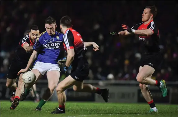  ?? Photo by Brendan Moran/Sportsfile ?? Conor Keane of Kerry and Legion attempts a shot at goal under pressure from Mayo players, from left, Kevin McLoughlin, Donie Newcombe and Donal Vaughan during the Allianz Football League Division 1 Round 2 match between Kerry and Mayo at Austin Stack...