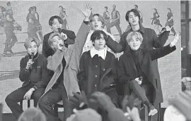  ?? DIA DIPASUPIL/ GETTY IMAGES ?? From left, Jimin, Jungkook, RM, J- Hope, V, Jin, and SUGA of the K- pop boy band BTS visit the “Today” Show at Rockefelle­r Plaza in New York City on Feb. 21.