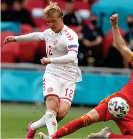  ?? -Photo: Nampa/AFP ?? On target…Denmark’s forward Kasper Dolberg (L) shoots to score their first goal during the UEFA EURO 2020 match against Wales on Saturday.