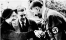  ?? Photograph: PA ?? The Duke and Duchess of Windsor greet Adolf Hitler.