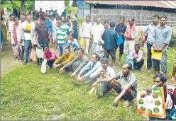  ?? AP FILE ?? ▪ People left out in the NRC draft wait to collect forms to file appeals near a centre in Guwahati. Complaints have been pouring since the final draft did not carry names of four million people on July 30.