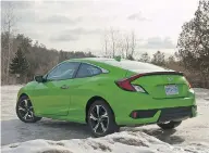  ?? LESLEY WIMBUSH / DRIVING.CA ?? The enormous LED tail lights of the 2017 Civic may be best described as part of “futuristic Meccano” design.