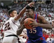  ?? BRAD TOLLEFSON — THE ASSOCIATED PRESS ?? Texas Tech’s TJ Holyfield (22) defends against Kansas’ Udoka Azubuike (35) during the first half of an NCAA college basketball game Saturday, March 7, 2020, in Lubbock, Texas.