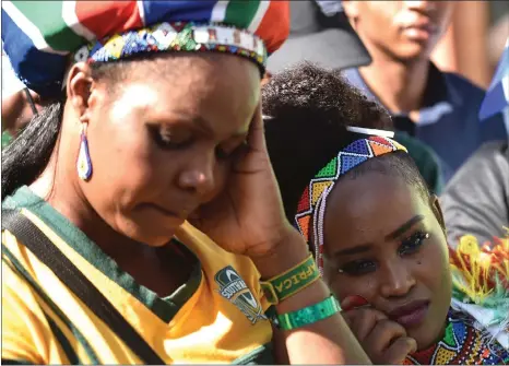  ?? Picture: BONGANI SHILUBANE, ANA PICTURES ?? DEVASTATED: Disappoint­ed South African fans at Sammy Marks Square in Pretoria after the announceme­nt that France would host the 2023 Rugby World Cup yesterday.
