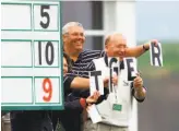  ?? Eric Risberg / Associated Press 2000 ?? Scorekeepe­rs spell out “Tiger” as Tiger Woods passes during the 2000 U.S. Open.
